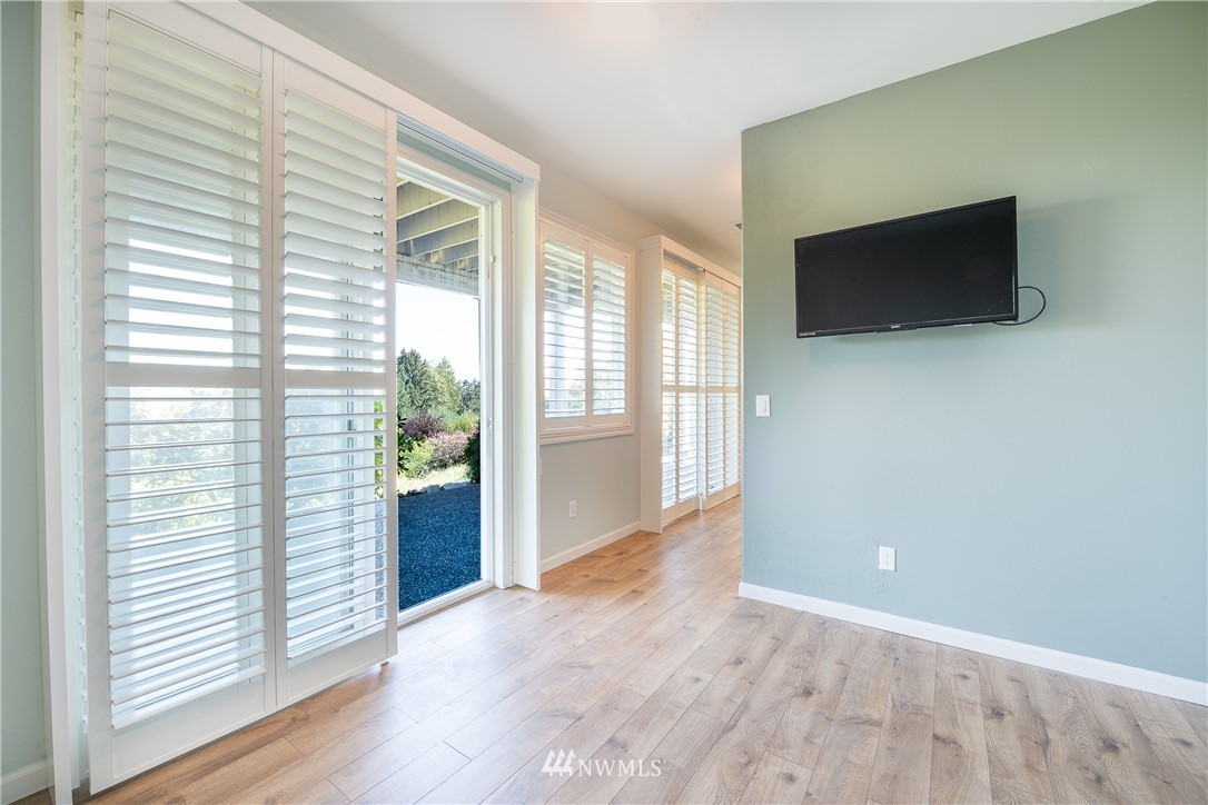 5332 Canvasback Loop Blaine, WA 98230 - Photo 34 of 40 a view of a livingroom with an empty space and a window