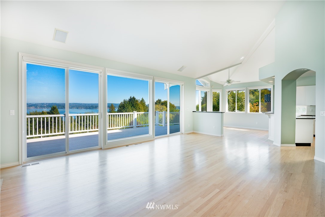 5332 Canvasback Loop Blaine, WA 98230 - Photo 6 of 40 a view of an empty room with wooden floor and a window