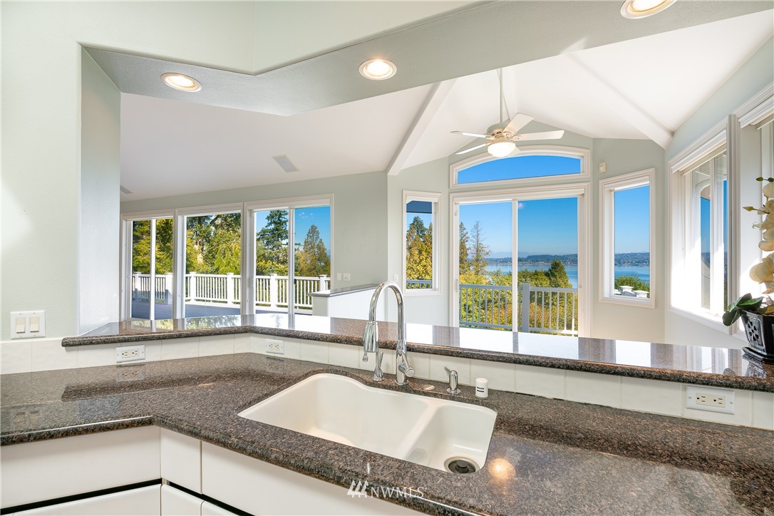 5332 Canvasback Loop Blaine, WA 98230 - Photo 10 of 40 a kitchen with granite countertop a sink and a counter top space