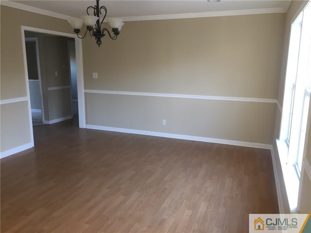 19 Fordham Road Old Bridge, NJ 08859 - Photo 4 of 16 an empty room with windows