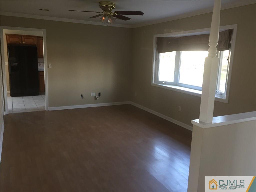 19 Fordham Road Old Bridge, NJ 08859 - Photo 6 of 16 an empty room with a window