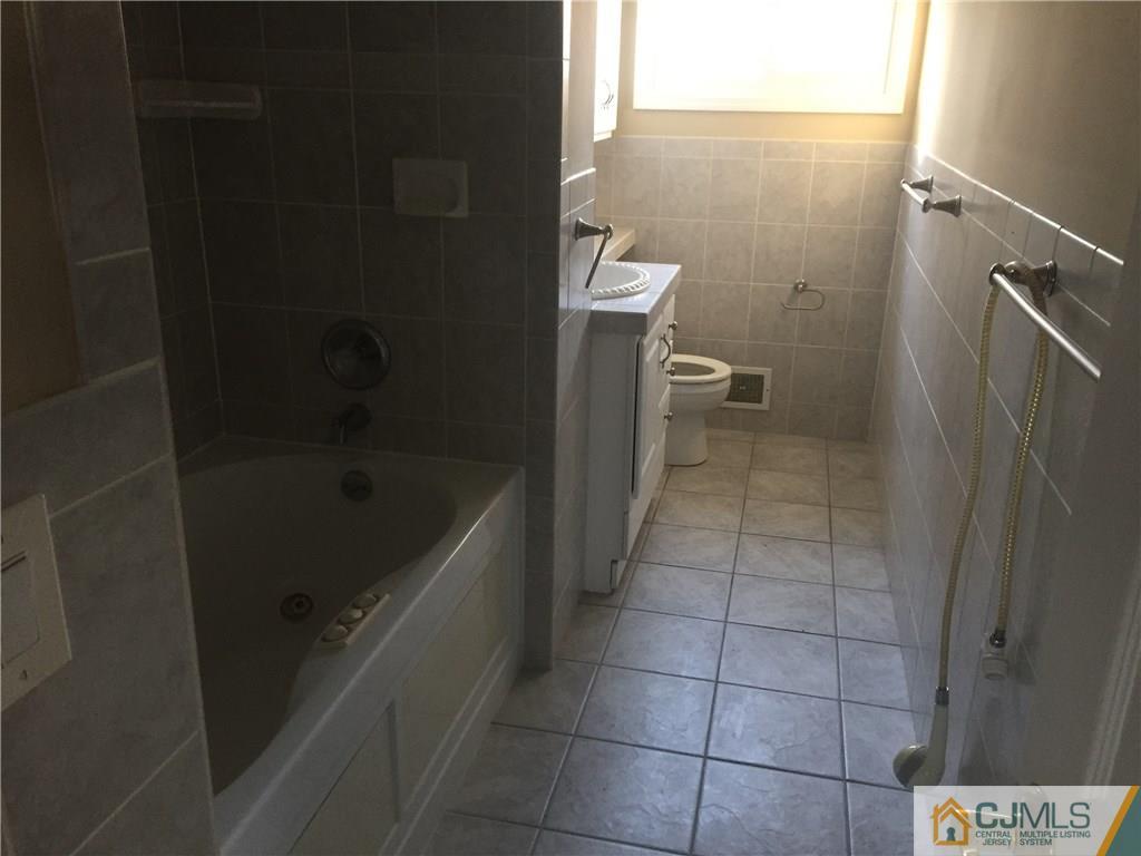 19 Fordham Road Old Bridge, NJ 08859 - Photo 7 of 16 a bathroom with a sink and toilet
