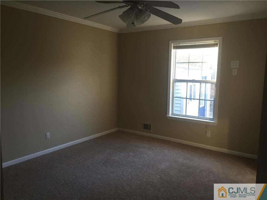 19 Fordham Road Old Bridge, NJ 08859 - Photo 10 of 16 an empty room with a window