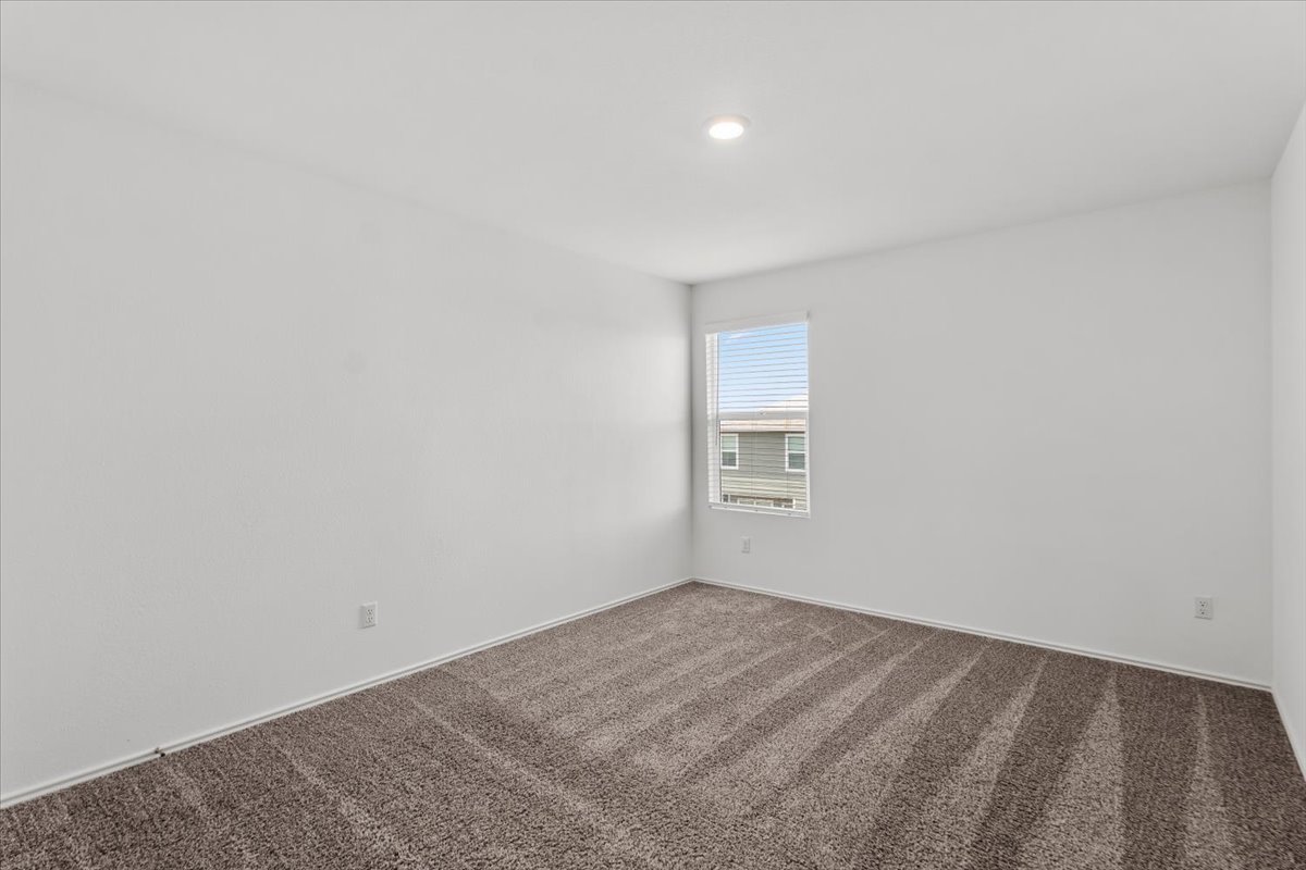 448 Perfect World Loop Jarrell, TX 76537 - Photo 39 of 40 A spacious chamber, naturally illuminated, provides a tranquil personal retreat with plush carpeting.
