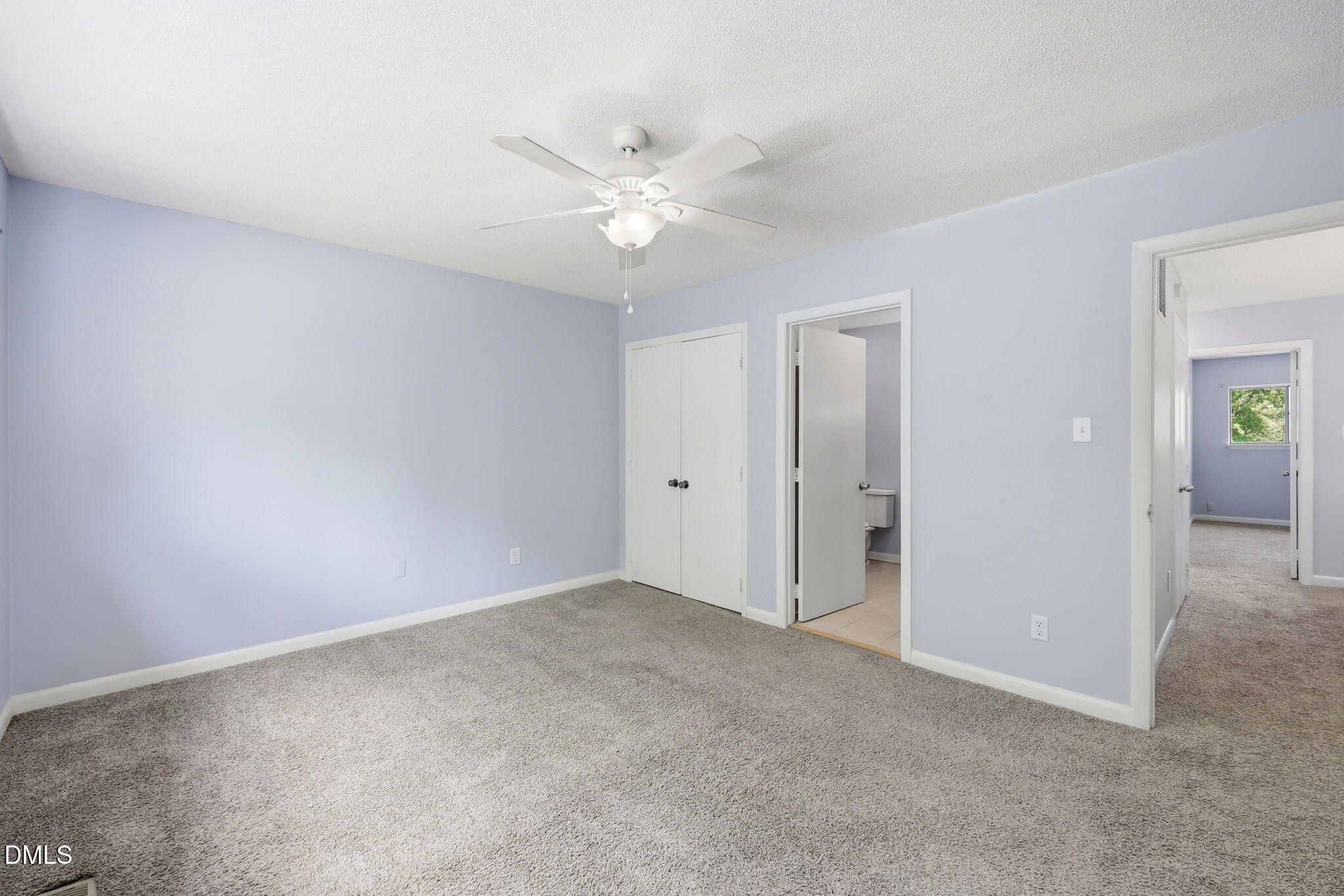 5043 Tall Pines Court Raleigh, NC 27609 - Photo 19 of 37 a view of an empty room with a ceiling fan