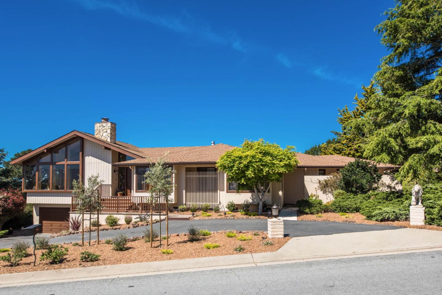 24800 Outlook Drive Carmel, CA 93923 - Photo 1 of 17 a front view of a house with a yard