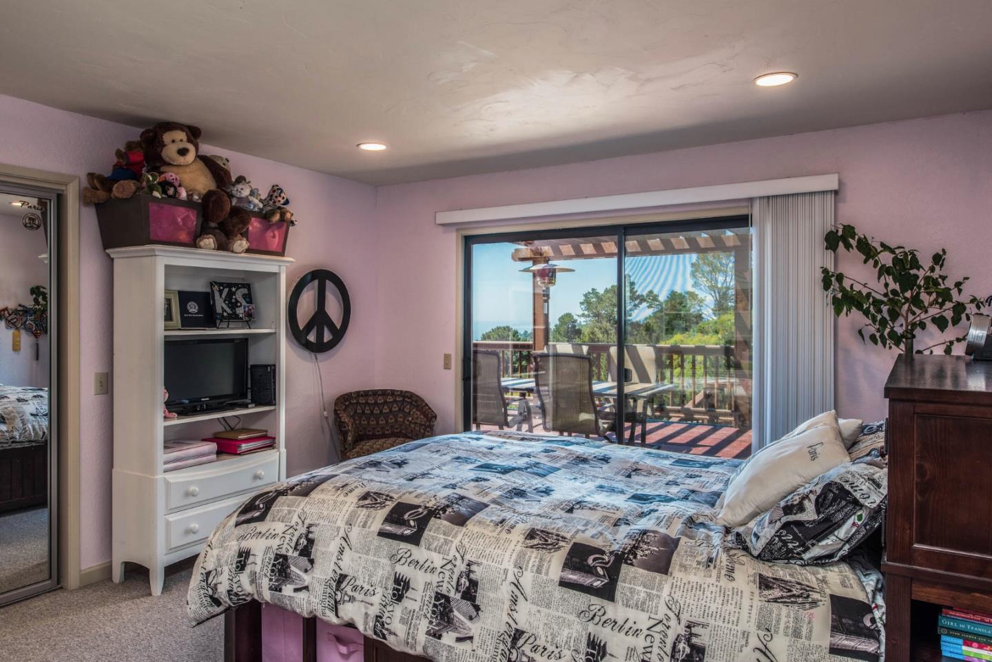 24800 Outlook Drive Carmel, CA 93923 - Photo 12 of 17 a bedroom with a bed and a large window