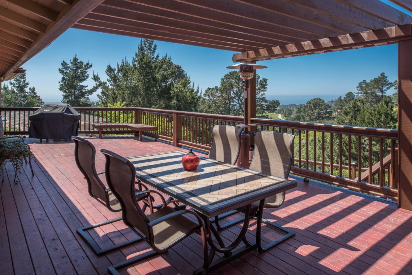 24800 Outlook Drive Carmel, CA 93923 - Photo 16 of 17 a view of a balcony with wooden floor and outdoor seating