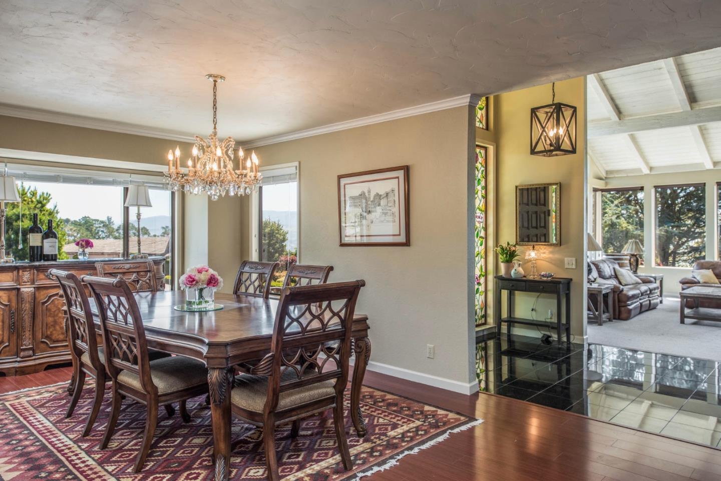 24800 Outlook Drive Carmel, CA 93923 - Photo 7 of 17 a view of a dining room with furniture window and chandelier
