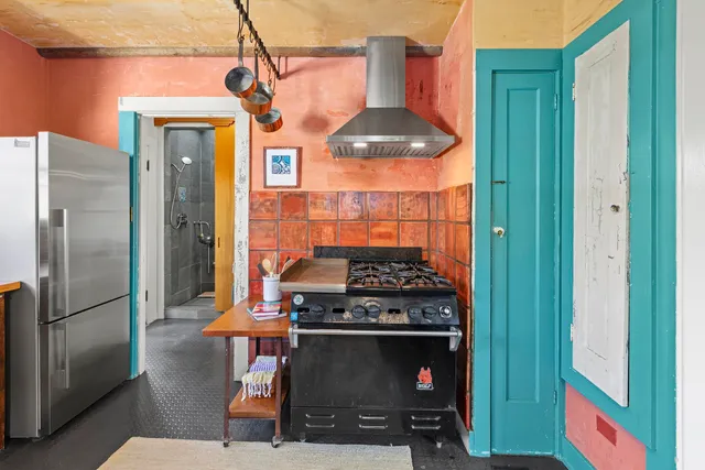 a bedroom with a bed and a couch