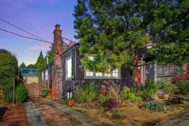 a front view of a house with garden