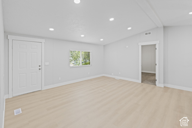 96 Barrington Way Layton, UT 84041 - Photo 9 of 18 Recessed lighting, light wood-finish flooring, white trim, a multi-pane door, and a framed doorway