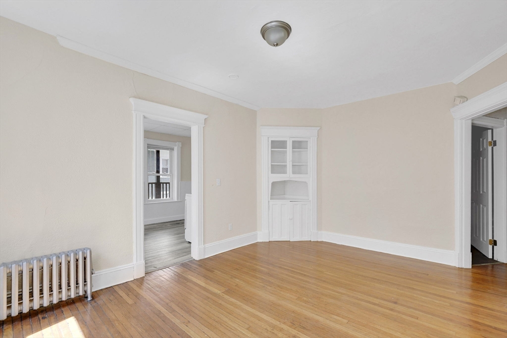 242 Fort Pleasant Avenue Springfield, MA 01108 - Photo 14 of 42 a view of empty room with wooden floor and fan