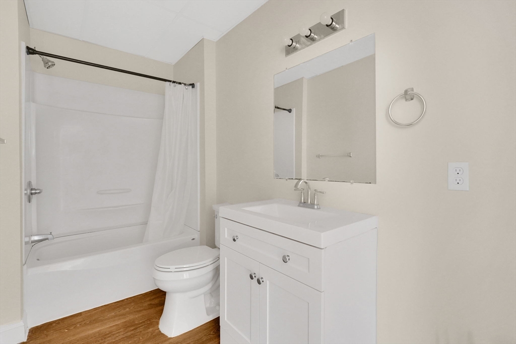 242 Fort Pleasant Avenue Springfield, MA 01108 - Photo 18 of 42 a bathroom with a sink a toilet and shower