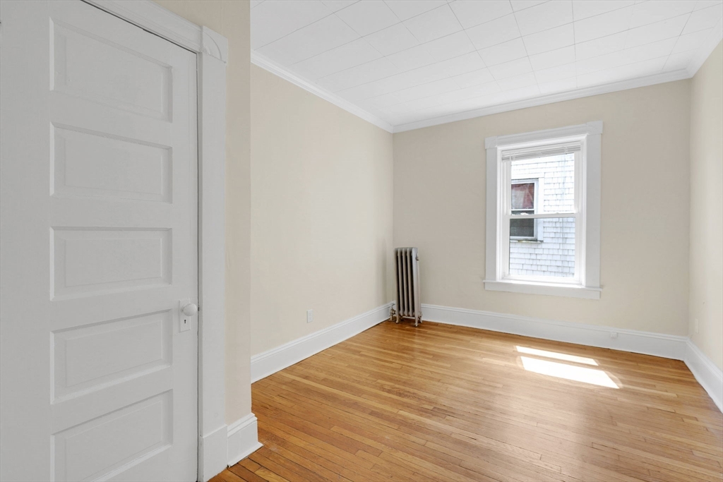 242 Fort Pleasant Avenue Springfield, MA 01108 - Photo 19 of 42 a view of empty room with wooden floor