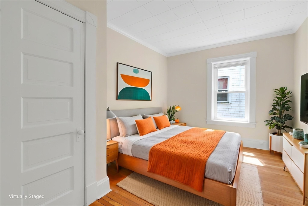 242 Fort Pleasant Avenue Springfield, MA 01108 - Photo 20 of 42 a bedroom with a bed and a potted plant