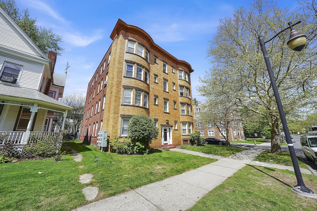 242 Fort Pleasant Avenue Springfield, MA 01108 - Photo 2 of 42 a view of a building with a yard