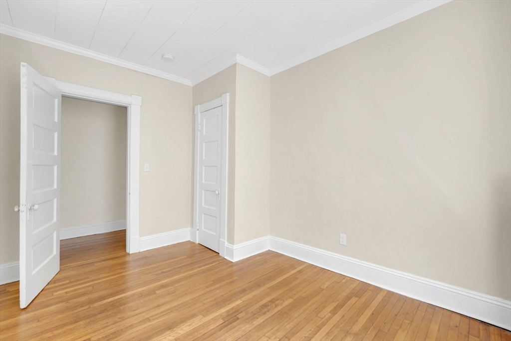 242 Fort Pleasant Avenue Springfield, MA 01108 - Photo 21 of 42 a view of an empty room with wooden floor