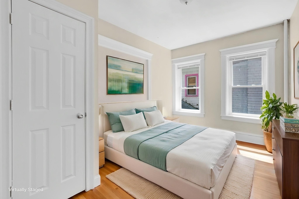 242 Fort Pleasant Avenue Springfield, MA 01108 - Photo 23 of 42 a bedroom with a bed and a potted plant