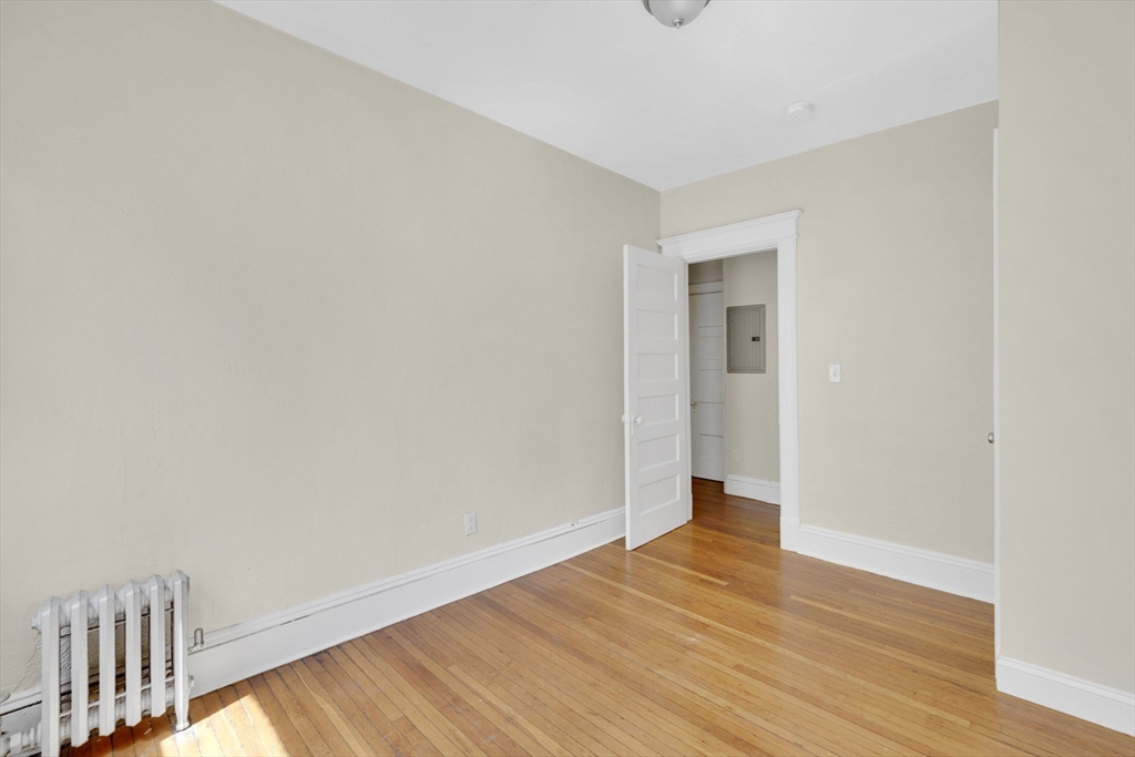 242 Fort Pleasant Avenue Springfield, MA 01108 - Photo 24 of 42 a view of an empty room with wooden floor