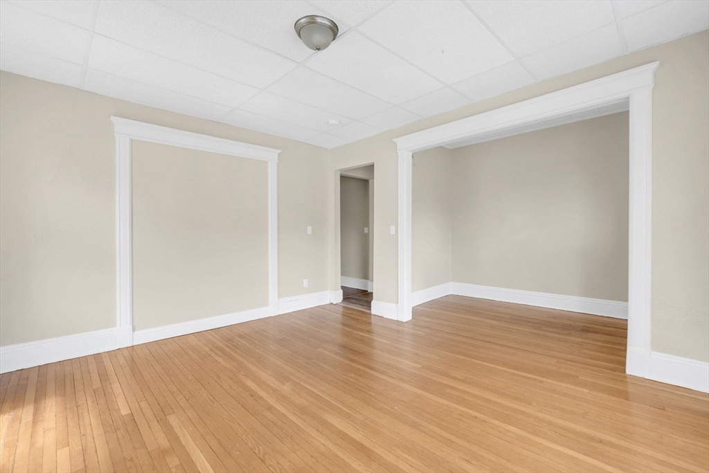 242 Fort Pleasant Avenue Springfield, MA 01108 - Photo 28 of 42 a view of an empty room with wooden floor and a window