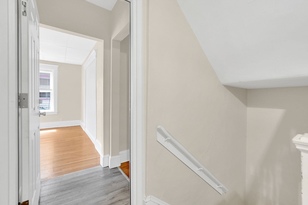 242 Fort Pleasant Avenue Springfield, MA 01108 - Photo 31 of 42 a view of a hallway with wooden floor and entryway
