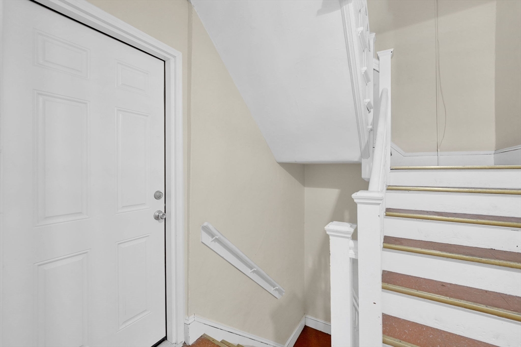 242 Fort Pleasant Avenue Springfield, MA 01108 - Photo 33 of 42 a view of staircase with white walls and white door