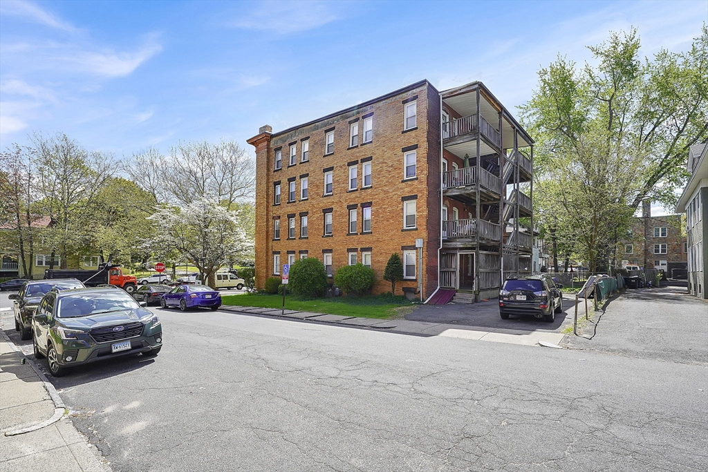 242 Fort Pleasant Avenue Springfield, MA 01108 - Photo 5 of 42 a view of a cars parked in front of a building