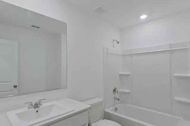 a bathroom with a sink toilet and bathtub