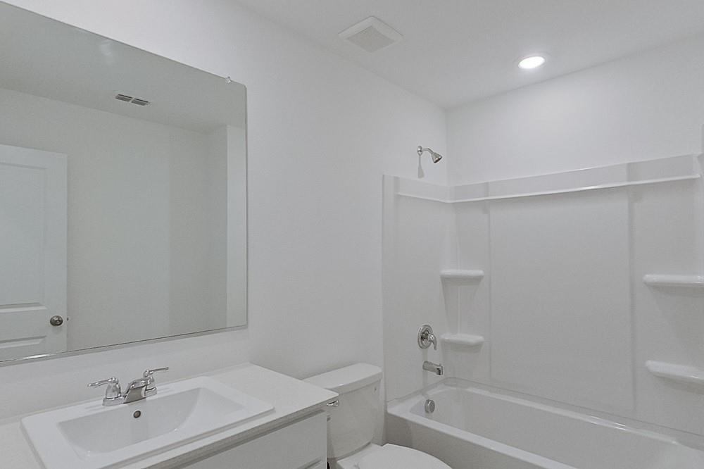 2908 Yellow Pine Avenue Fort Worth, TX 76179 - Photo 12 of 23 a bathroom with a sink toilet and bathtub