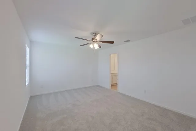 a view of a chandelier fan and window