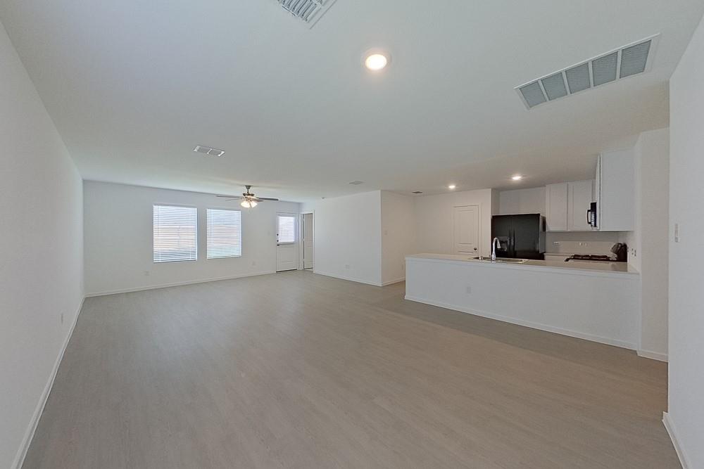 2908 Yellow Pine Avenue Fort Worth, TX 76179 - Photo 2 of 23 a view of a kitchen with a sink and a stove top oven