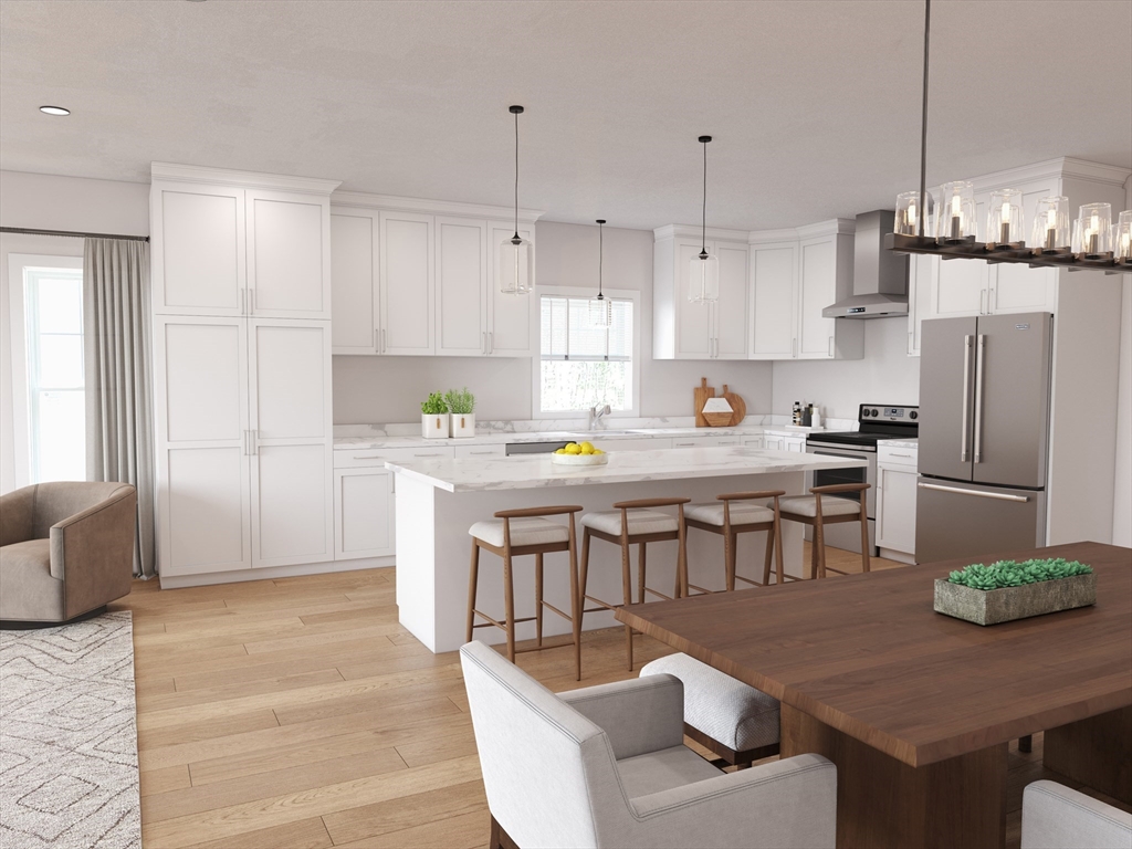 22 Shoemaker Lane, Unit 13 Upton, MA 01568 - Photo 1 of 5 a kitchen with stainless steel appliances granite countertop a refrigerator a sink a stove a dining table and chairs