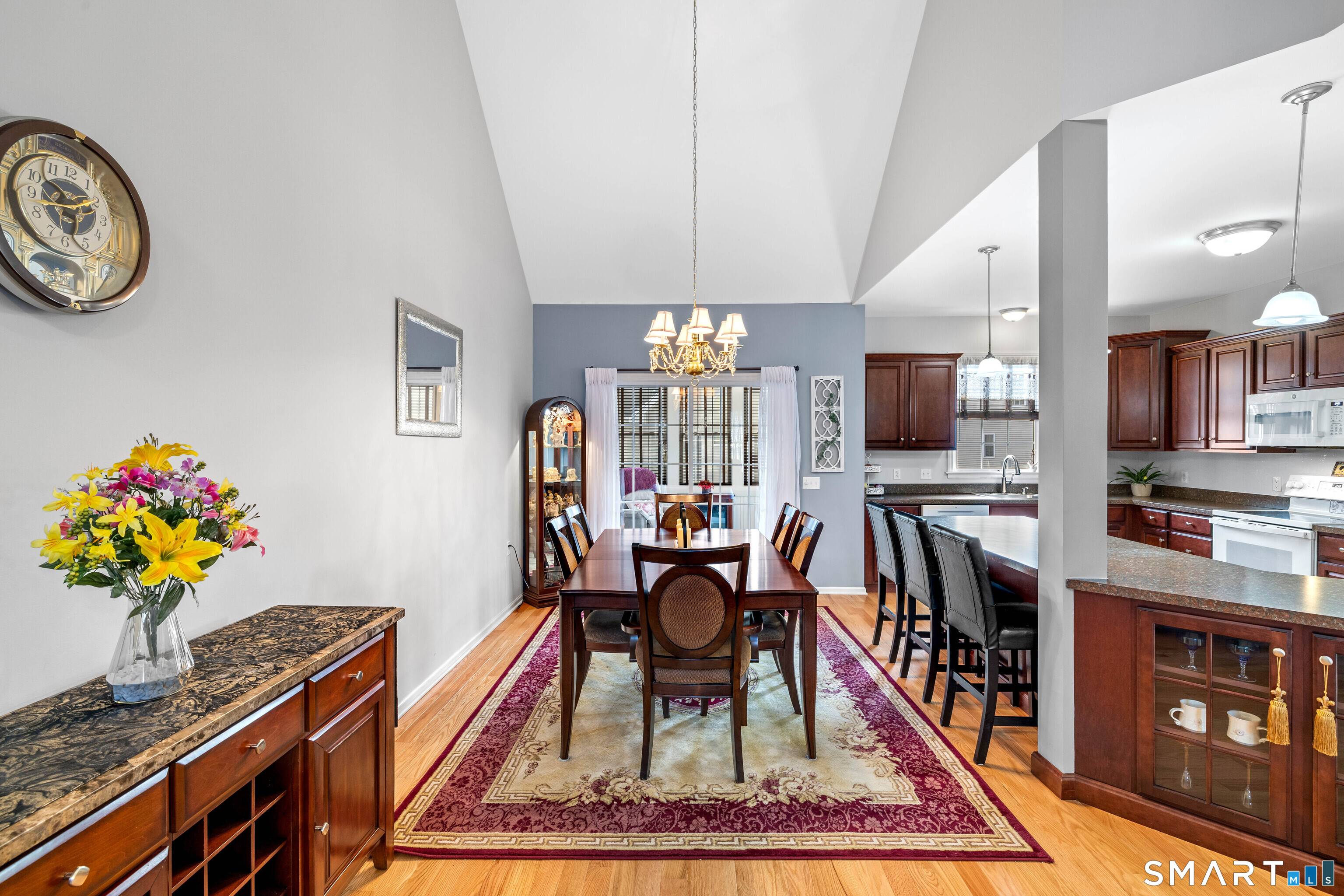 24 Phillips Farm Road, Unit 24 East Hartford, CT 06118 - Photo 11 of 34 a living room with furniture a rug and a flat screen tv