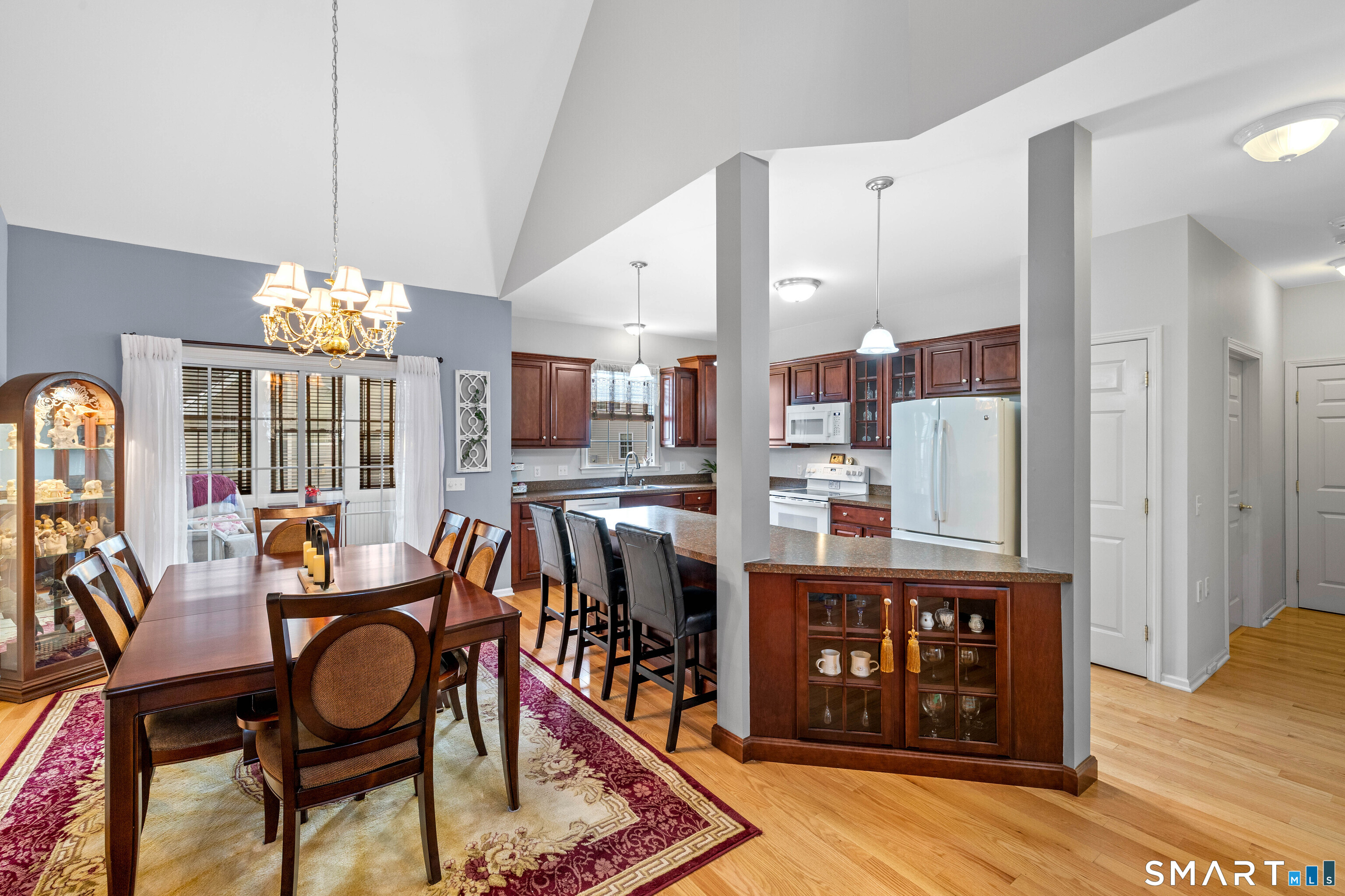 24 Phillips Farm Road, Unit 24 East Hartford, CT 06118 - Photo 12 of 34 a view of a dining room with furniture and chandelier