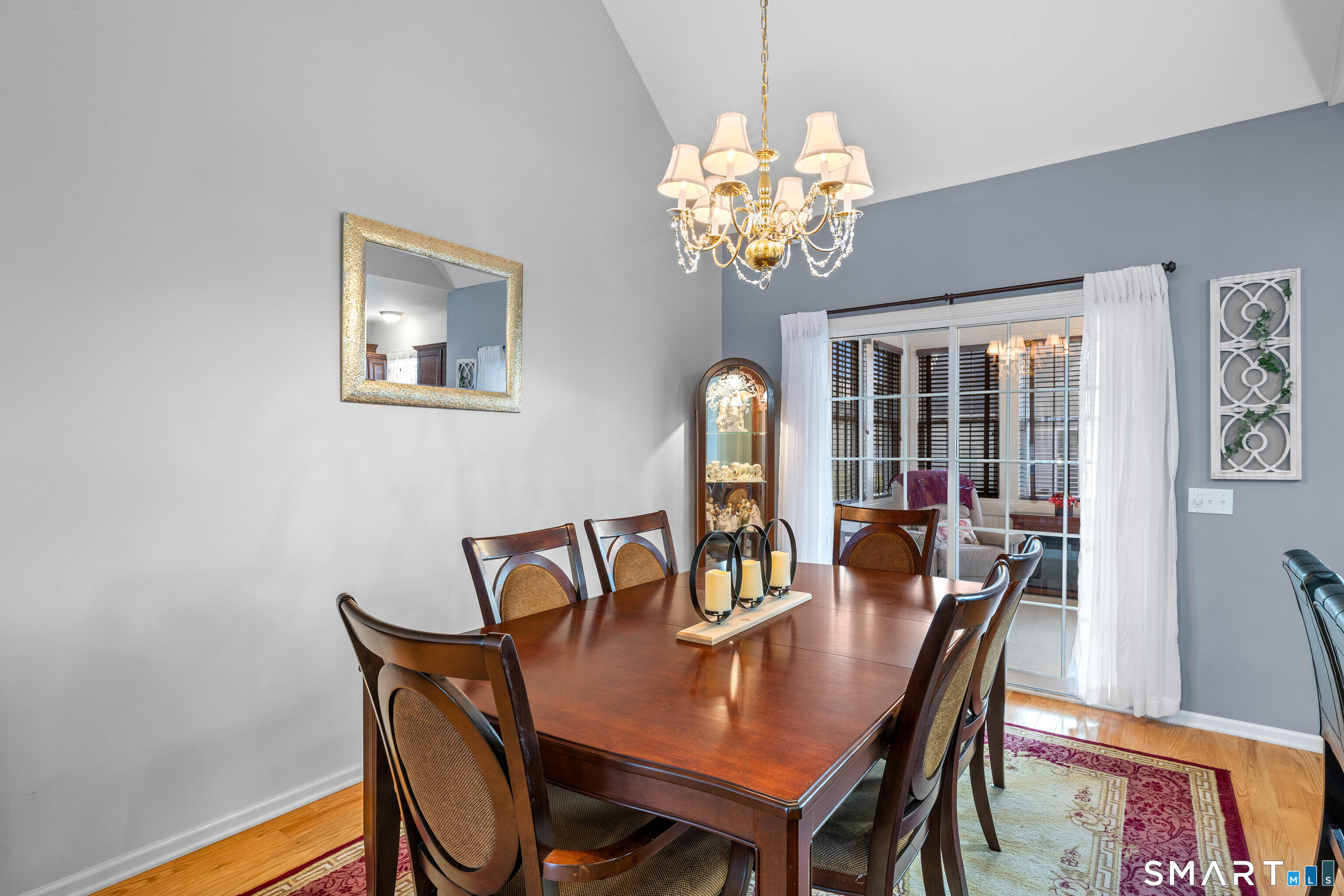 24 Phillips Farm Road, Unit 24 East Hartford, CT 06118 - Photo 13 of 34 a view of a dining room with furniture window and wooden floor