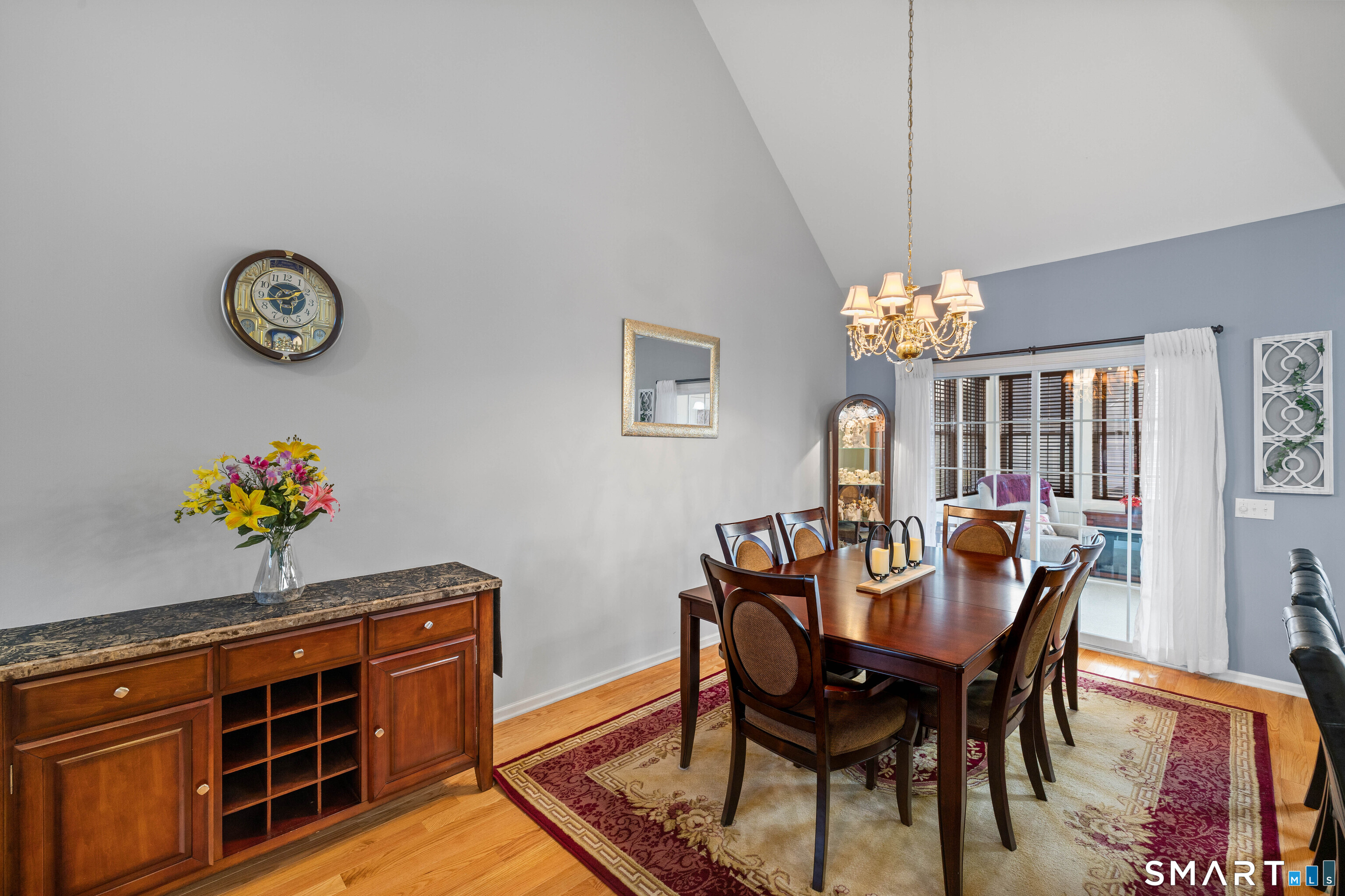 24 Phillips Farm Road, Unit 24 East Hartford, CT 06118 - Photo 18 of 34 a view of a dining room with furniture and chandelier