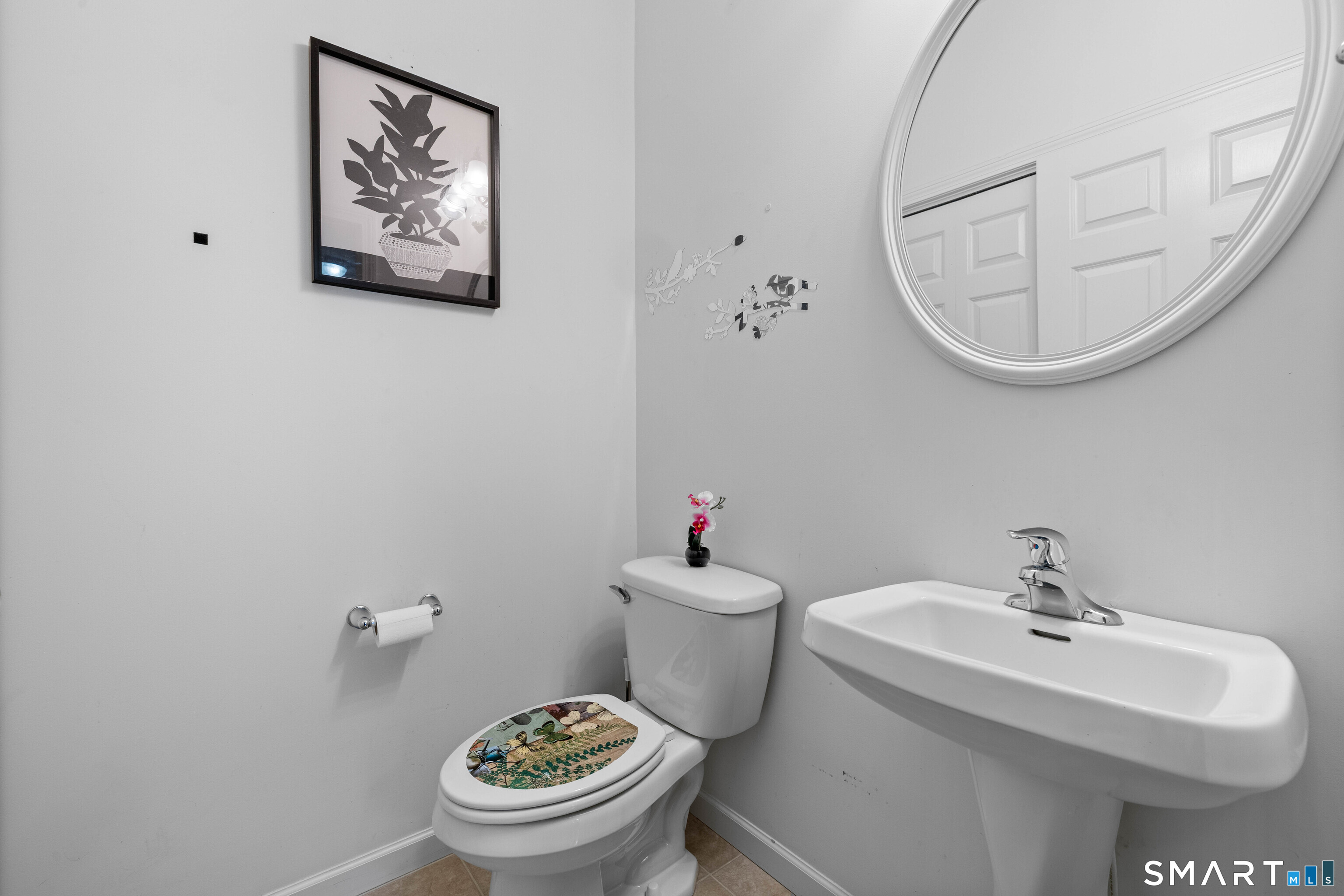 24 Phillips Farm Road, Unit 24 East Hartford, CT 06118 - Photo 21 of 34 a bathroom with a toilet a sink and a mirror