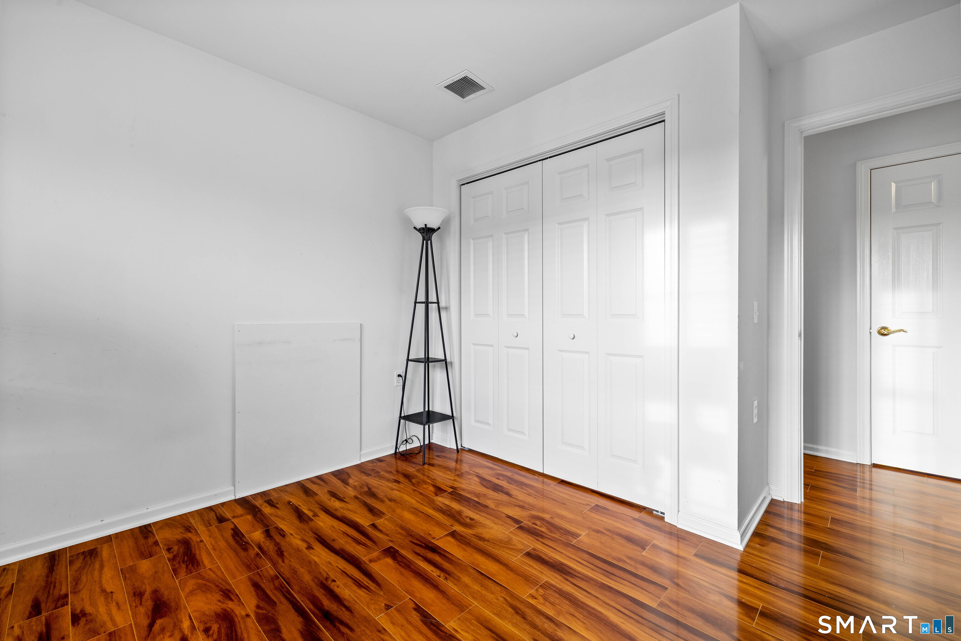 24 Phillips Farm Road, Unit 24 East Hartford, CT 06118 - Photo 32 of 34 a view of empty room with wooden floor