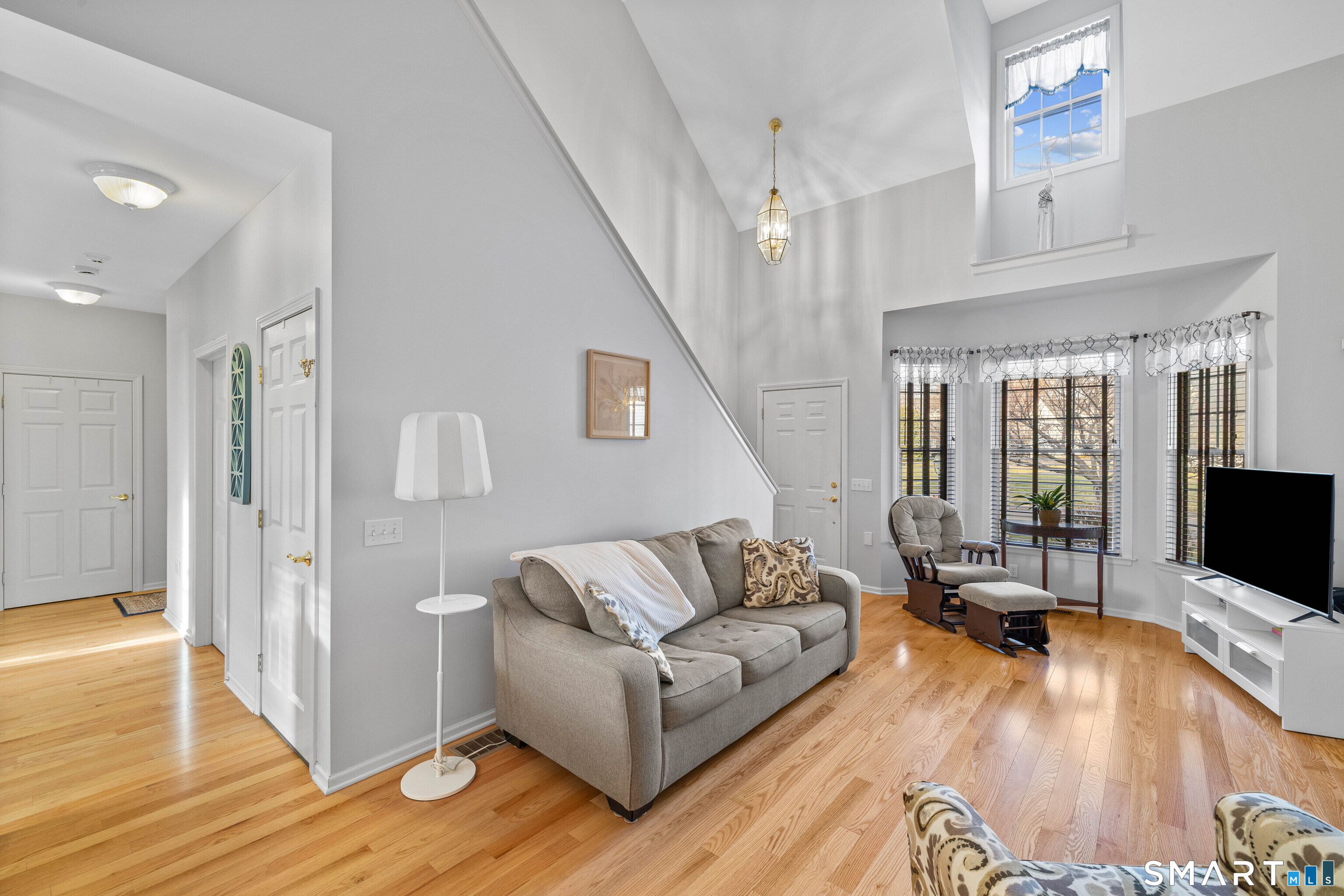 24 Phillips Farm Road, Unit 24 East Hartford, CT 06118 - Photo 10 of 34 a living room with furniture and a flat screen tv