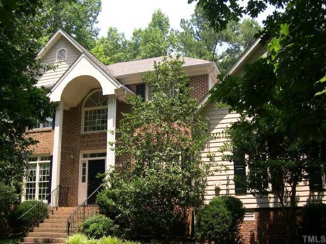 1704 Crown Glenn Place Raleigh, NC 27613 - Photo 1 of 4 a front view of a house with a yard and trees