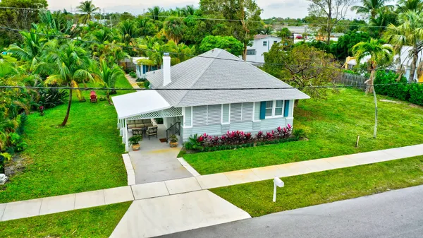 an aerial view of a house with swimming pool