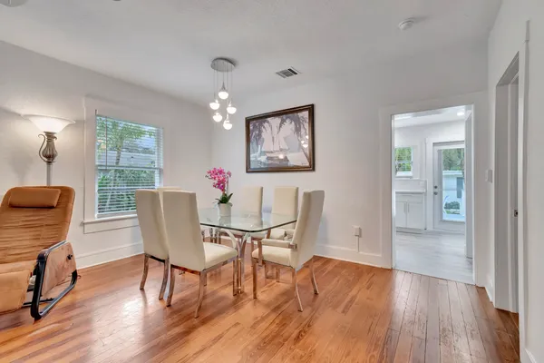 a kitchen with a white cabinets and white appliances