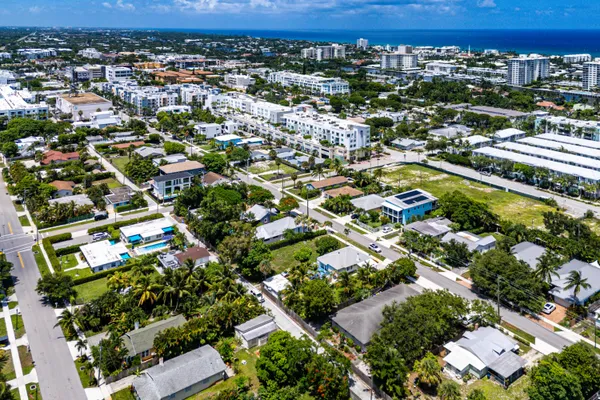 an aerial view of residential houses with outdoor space