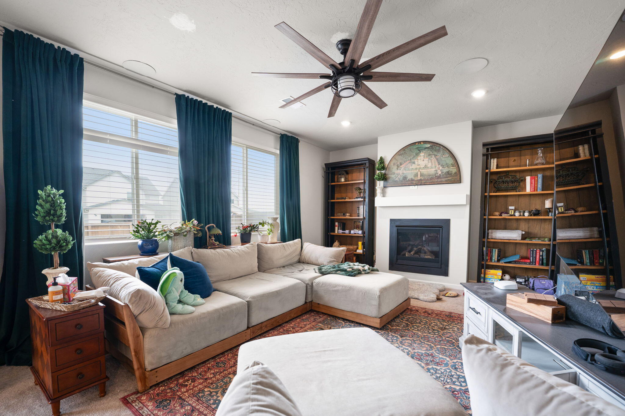 4039 Southwest Quartz Place Redmond, OR 97756 - Photo 19 of 44 a living room with furniture a fireplace and a large window