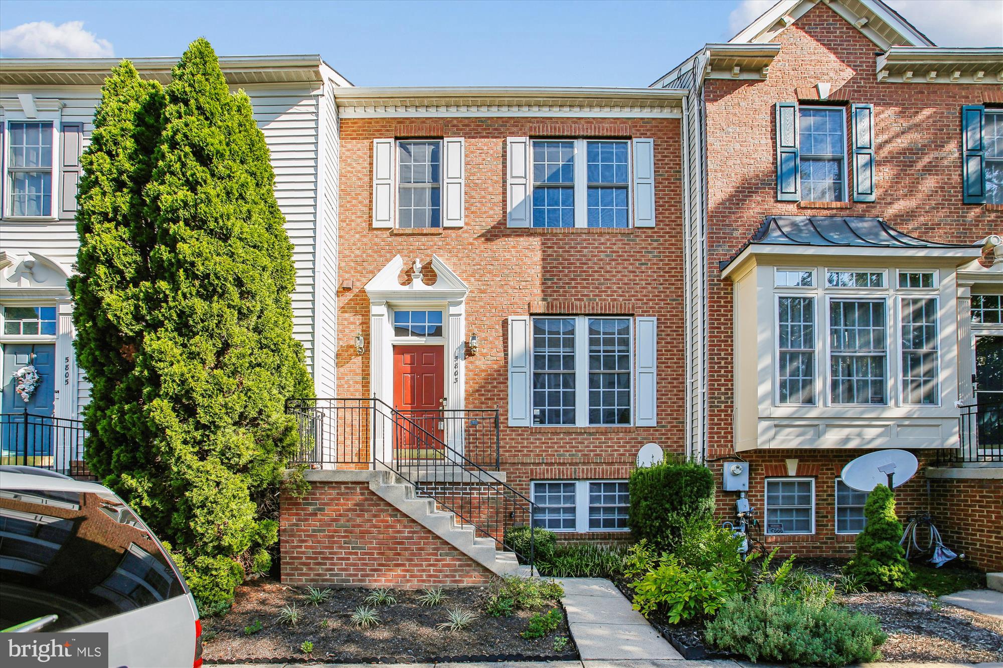 5803 Summers Grove Road Alexandria, VA 22304 - Photo 1 of 43 a front view of a house with a yard and potted plants