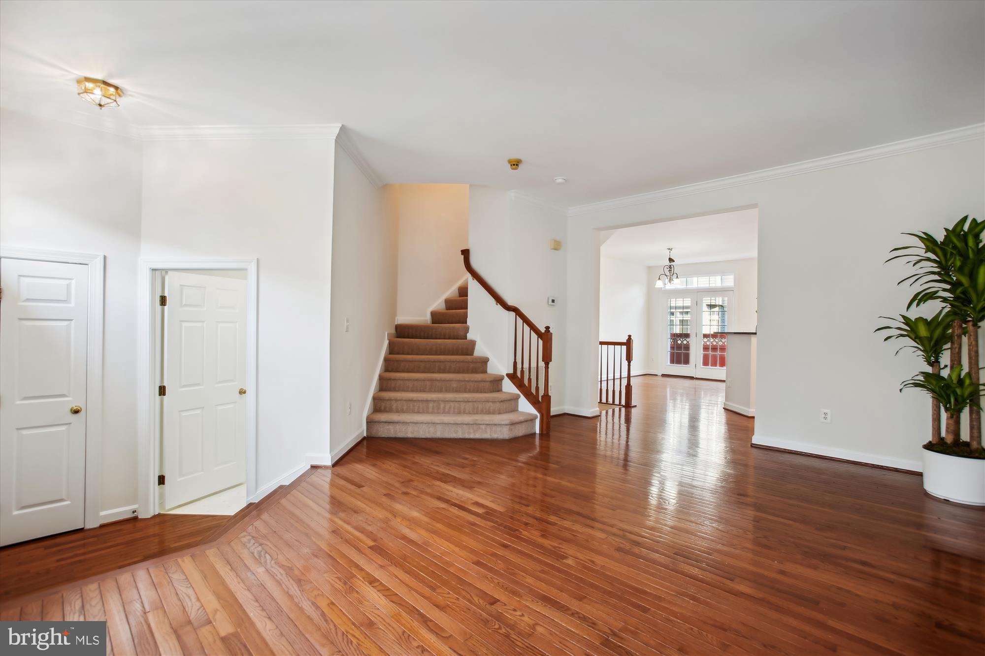 5803 Summers Grove Road Alexandria, VA 22304 - Photo 11 of 43 a view of an empty room with wooden floor and stairs
