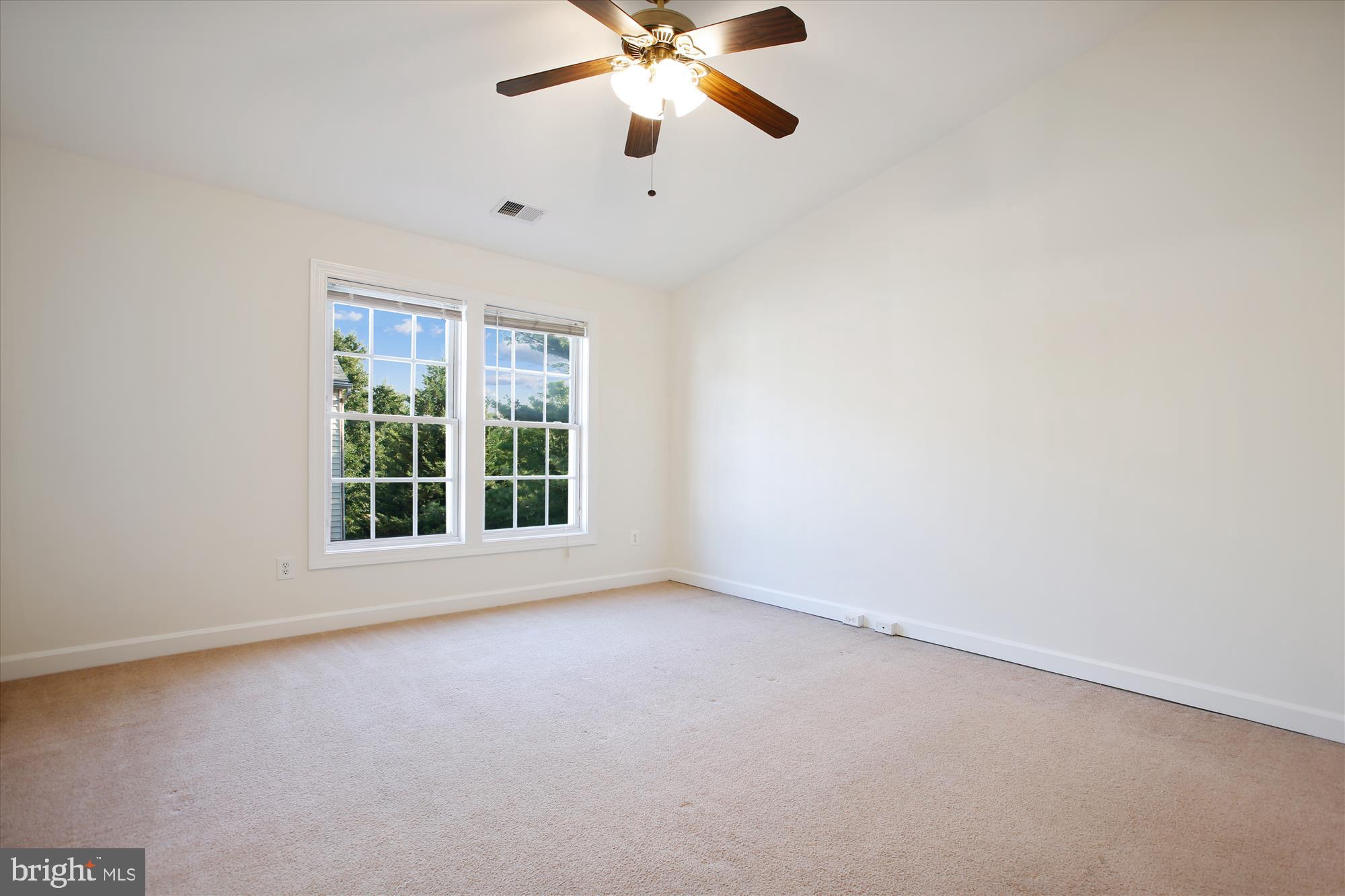 5803 Summers Grove Road Alexandria, VA 22304 - Photo 15 of 43 an empty room with window and a ceiling fan