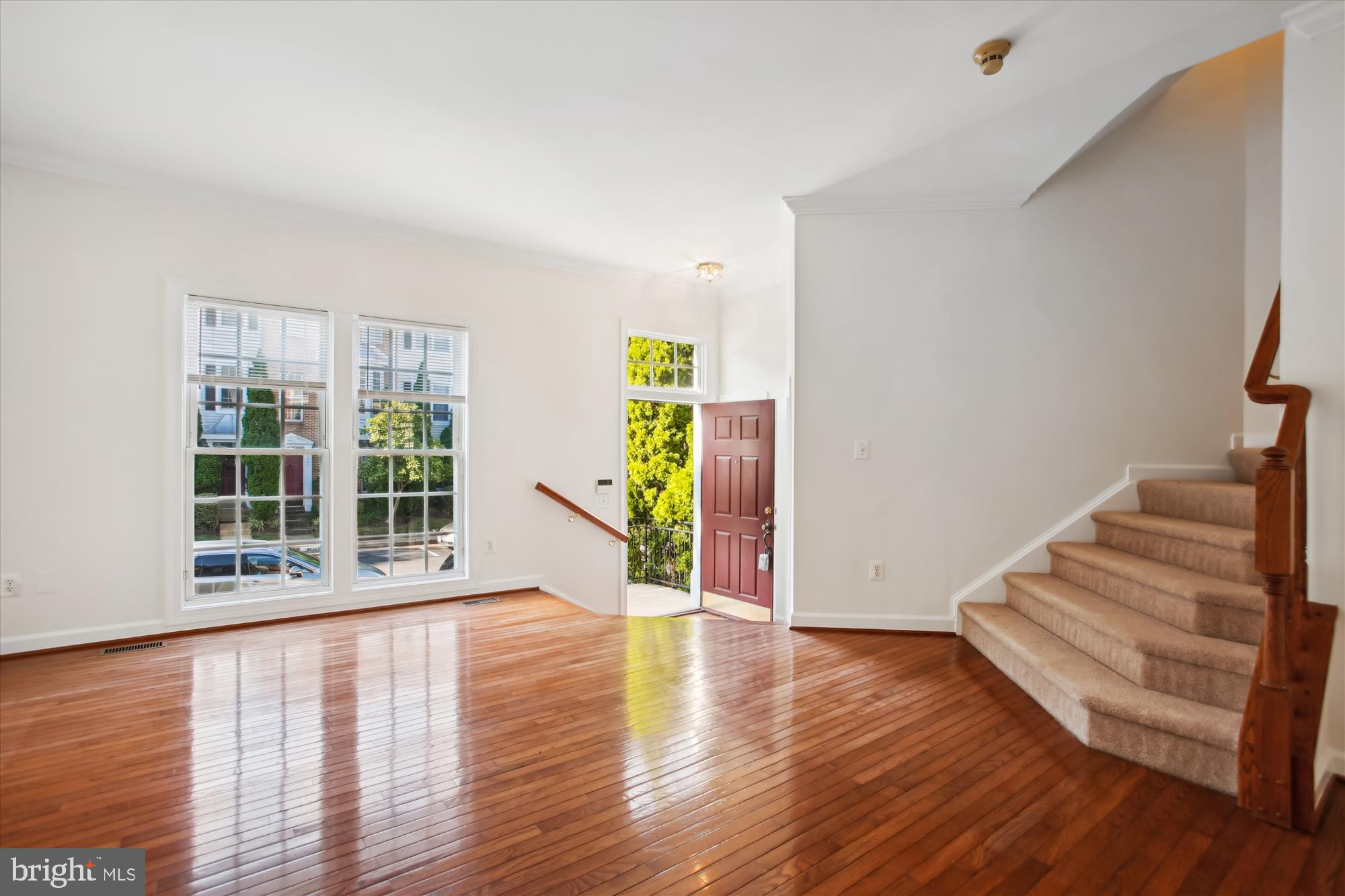5803 Summers Grove Road Alexandria, VA 22304 - Photo 2 of 43 a view of an entryway with wooden floor and windows