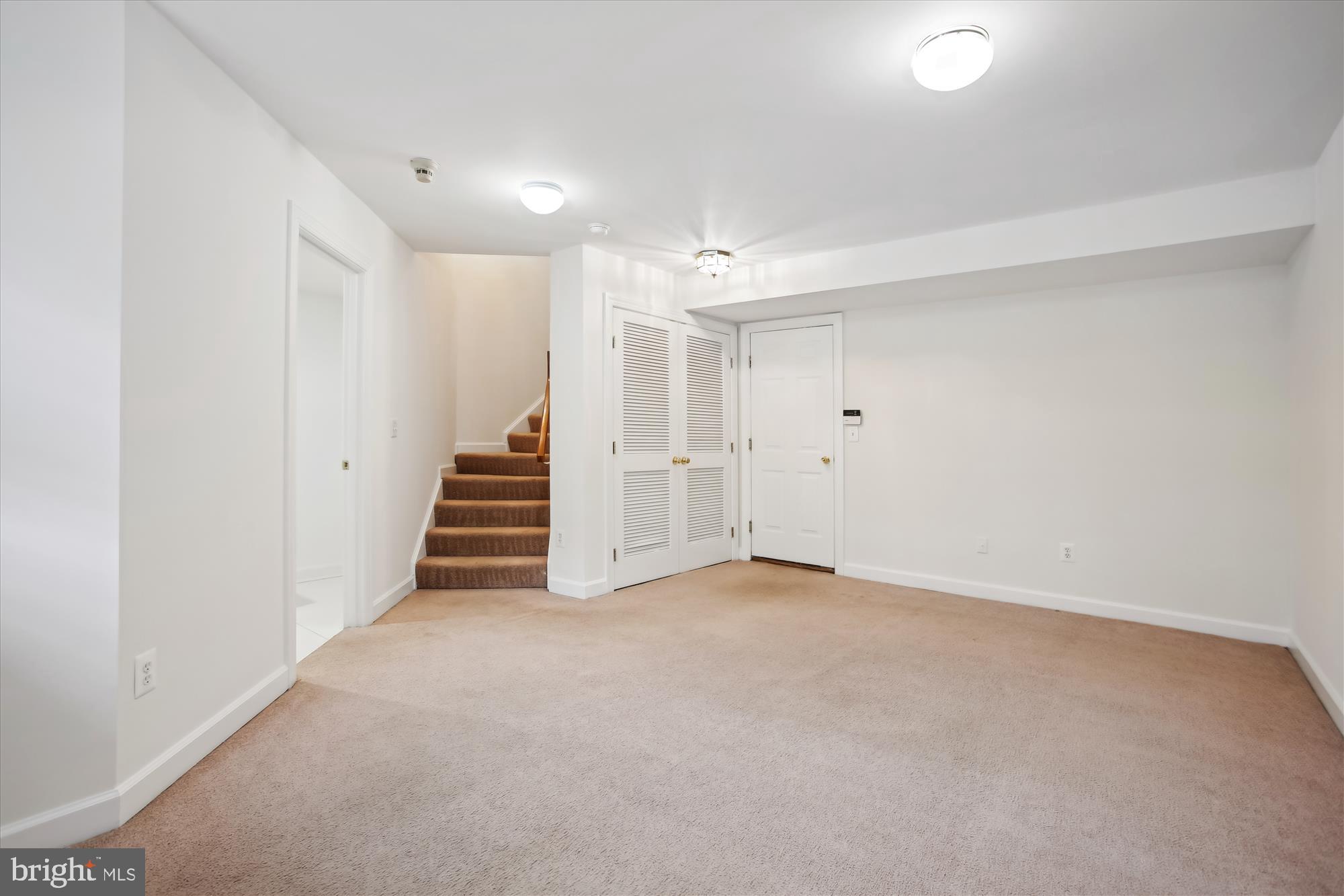 5803 Summers Grove Road Alexandria, VA 22304 - Photo 27 of 43 an empty room with a staircase and white walls
